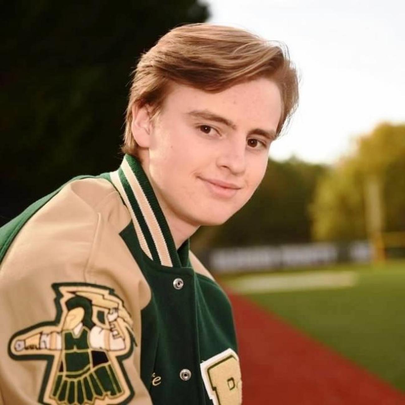 Nick in Letter Jacket-square for website.jpg